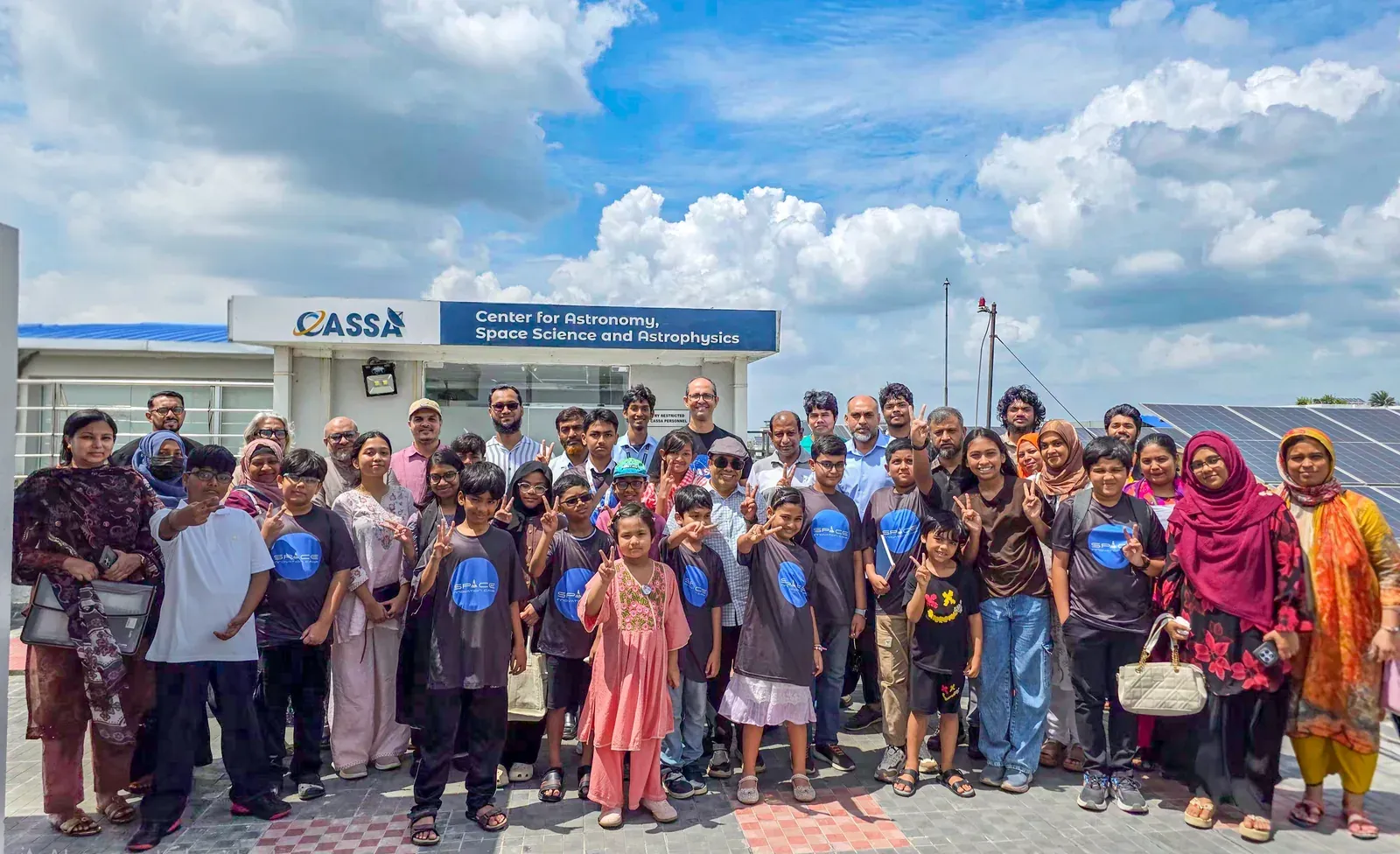 Students of Space Innovation Camp, aged five to thirteen, and their guardians gather with CASSA's astronomer, research assistants, interns, and volunteers on the rooftop of IUB's academic building at CASSA.