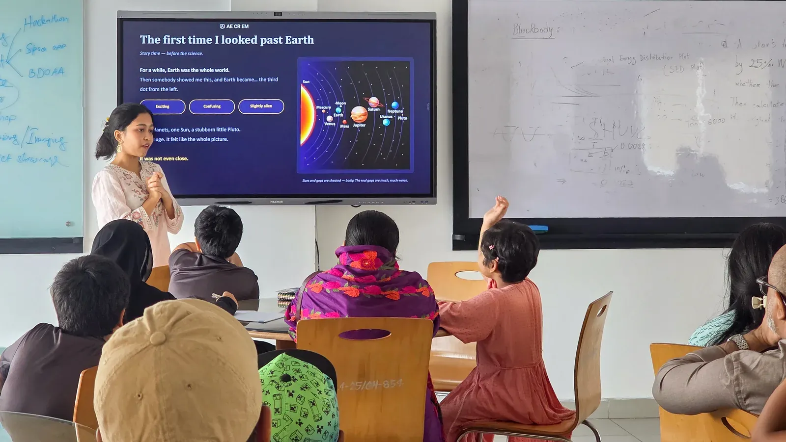 Farhana Ferdous leads the Cosmic Scale session, standing beside a slide reading "The first time I looked past Earth."