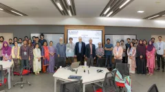 Participants, speakers and IUB officials of the TDMMA 2026 workshop stand together in front of the workshop title slide in the Digital Classroom at IUB.
