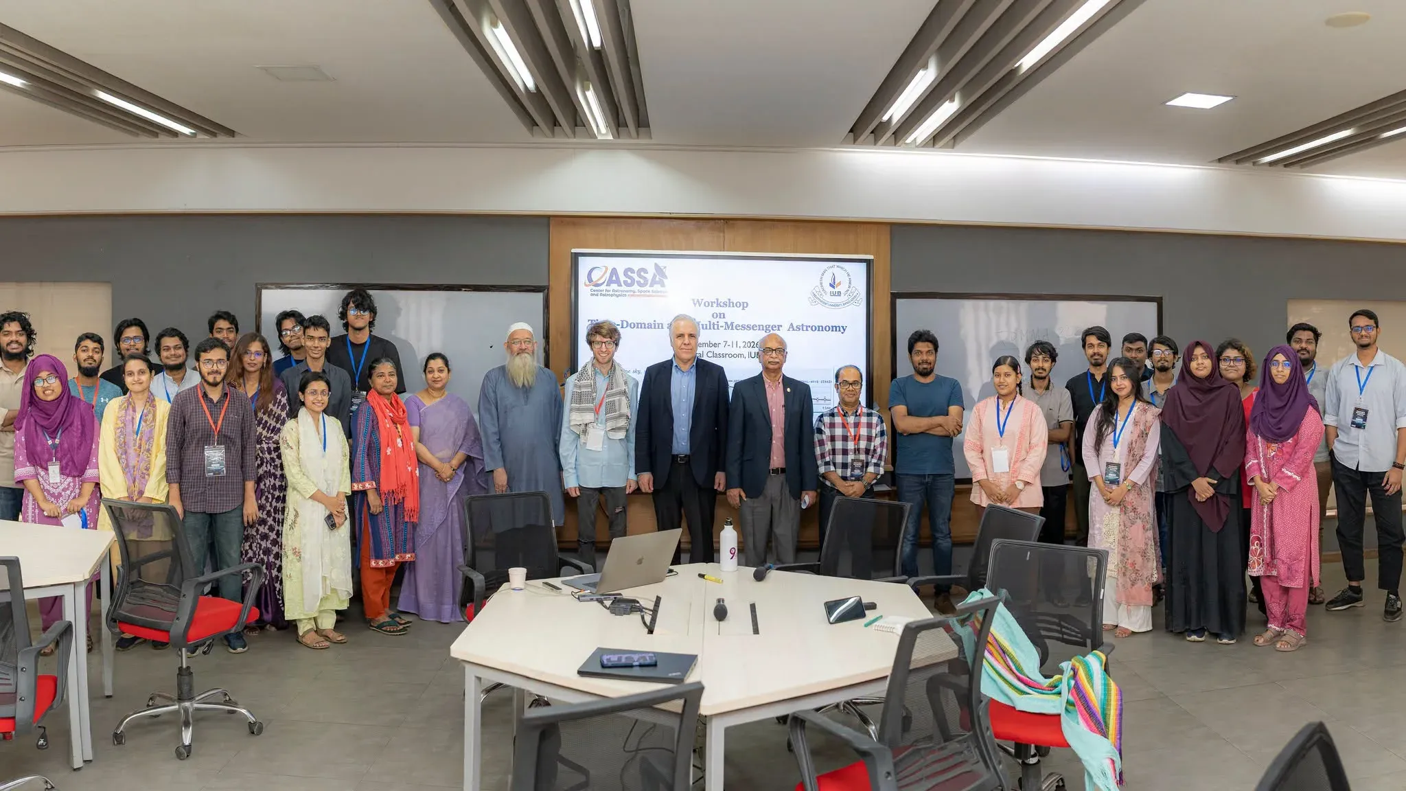 Participants, speakers and IUB officials of the TDMMA 2026 workshop stand together in front of the workshop title slide in the Digital Classroom at IUB.