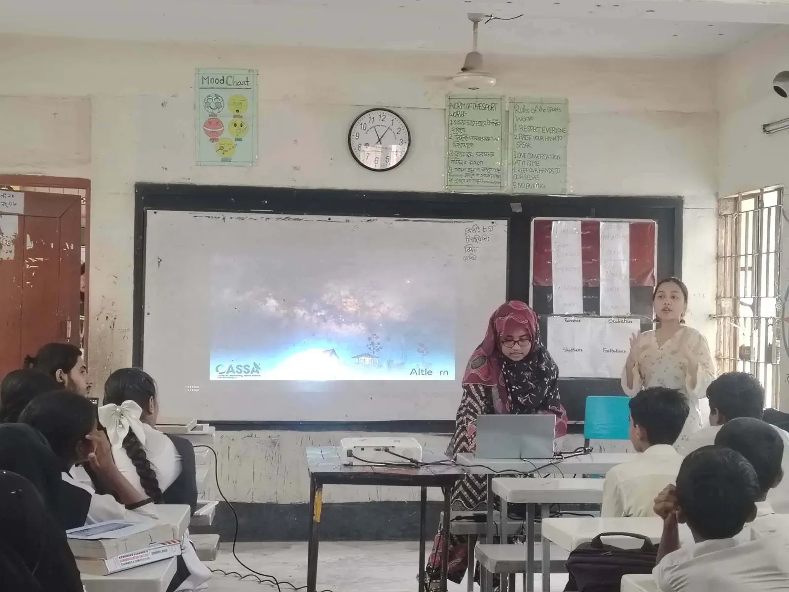Durbin volunteers introduce CASSA and Durbin to the students with a projected presentation.